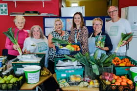 Laura Young, from Beyond Housing (centre), with the team from Eastfield Community Free Fridge.