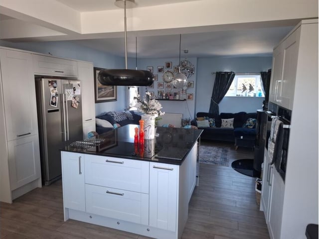 An open plan living kitchen with central island.