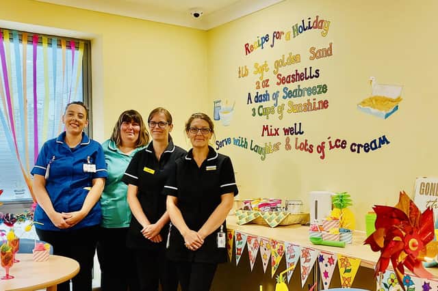 Pictured from left to right next to the mural in the new café are: Clinical Lead Amber Fryatt, activity co-ordinator Lizzie Brown, health care assistant Lucy Allerdice and Karen Wheelhouse – a trainee health care assistant and mural creator.
