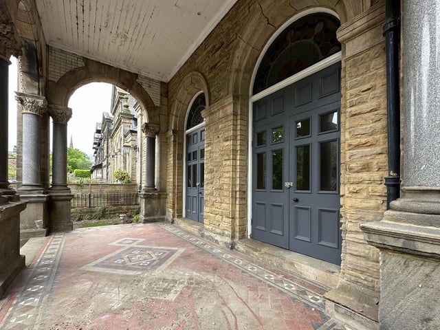A south-facing courtyard garden lies next to this impressive entrance.