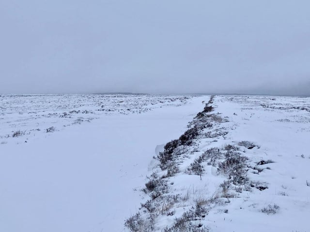 A blanket of fresh snow covered the moors.