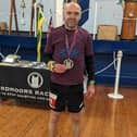 BRR athlete Danny Brunton shows off his medal after the Hardmoors 80 Mile.