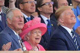 (L-R) Britain's Prince Charles, Prince of Wales, Britain's Queen Elizabeth II and US President Donald Trump look up as aircraft perform a fly-over during an event to commemorate the 75th anniversary of the D-Day landings, in Portsmouth, southern England, on June 5, 2019. - US President Donald Trump, Queen Elizabeth II and 300 veterans are to gather on the south coast of England on Wednesday for a poignant ceremony marking the 75th anniversary of D-Day. Other world leaders will join them in Portsmouth for Britain's national event to commemorate the Allied invasion of the Normandy beaches in France -- one of the turning points of World War II. (Photo by Daniel LEAL-OLIVAS / AFP)        (Photo credit should read DANIEL LEAL-OLIVAS/AFP/Getty Images)