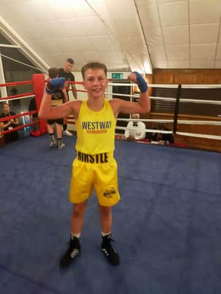 Westway Boxing Club's Preston Hirstle celebrates his win at Brighouse.