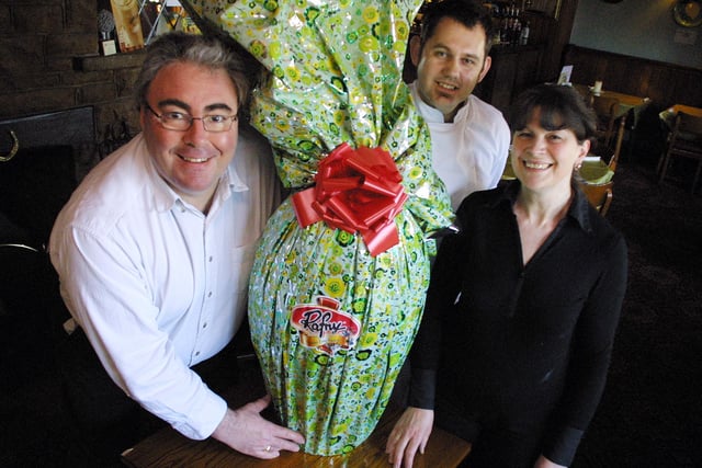 Michael Jivalu, head chef Lee Howes and Margaret Jivalu of The Three Horseshoes in Spitewinter in 2006 with the 5ft tall Easter Egg that will be raffled off to help Ashgate Croft School in Chesterfield.