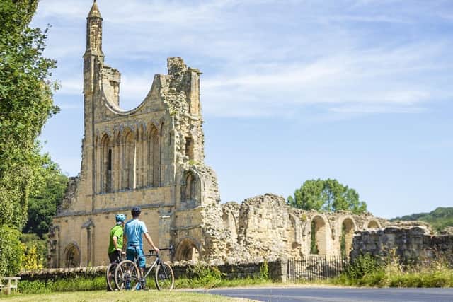 Two cyclists at Byland Abbey, one of the locations on the Hearts and Minds route.
Russell Barton