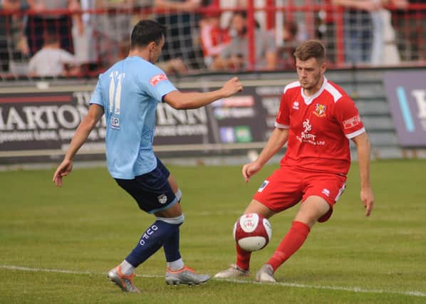 Benn Lewis headed in the first goal for Bridlington Town in their 2-0 Boxing Day win at home to basement club Tadcaster Albion.