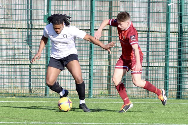 The home side try to get the ball away from the Hull United Development team. PHOTOS BY TCF PHOTOGRAPHY