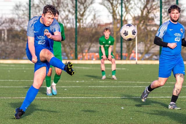 Sam Brown fires at the Slingsby goal. Photo by Brian Murfield