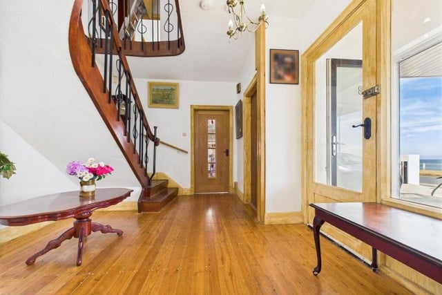 A bright hallway with feature staircase and gallery landing.