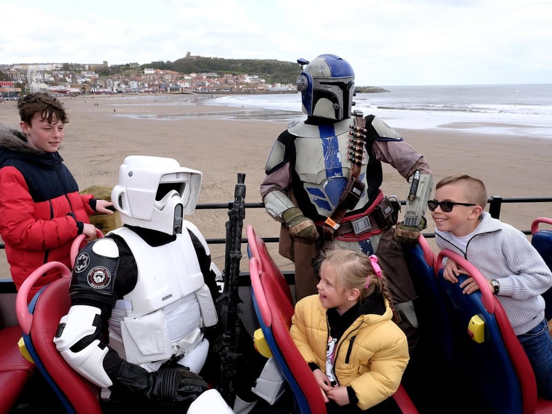Taking in the seaside sights on the open topped bus.