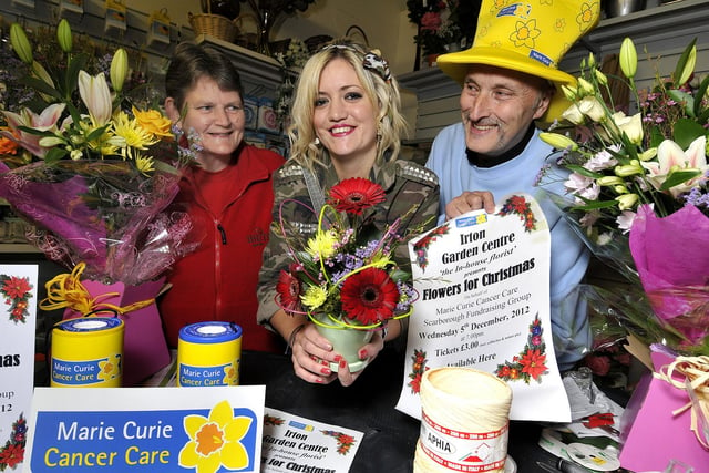 Irton Garden centre florist gets ready for charity demonstration in aid of Marie Curie. Staff member Julie Postill, florist Danielle Taylor, Marie Curies and Michael Streets.
Picture Richard Ponter, 124724.