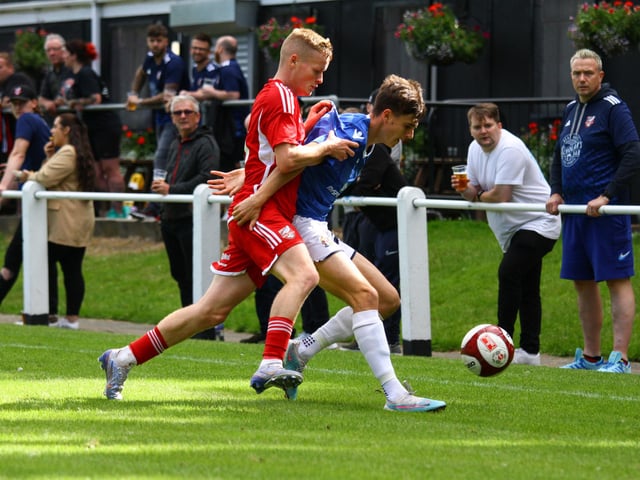 A Marske player is put under pressure by Boro winger Harry Green.