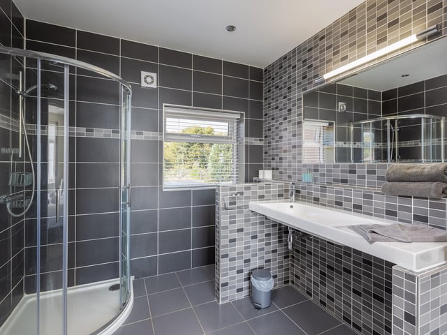 An on-trend shower room in grey.