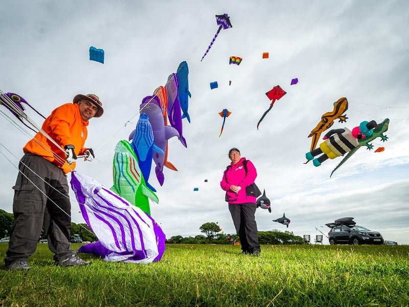 Andy and Anne De Sadeleer, of Filey, preparing their Whales kites for the day.