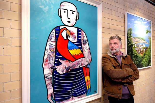 Scarborough-based artist Adam King with his prize-winning painting Blue Swimsuit