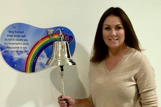 Gayle ringing the bell for the successful conclusion of her cancer treatment