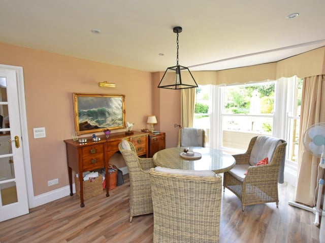 A light and lovely dining area, with bay window.