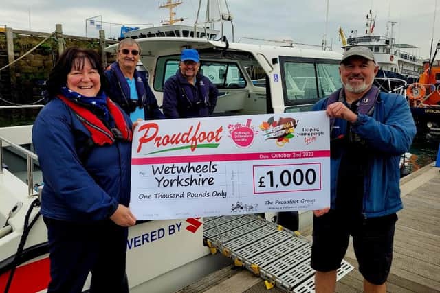 Proudfoot £1,000 cheque presentation to Wetwheels.