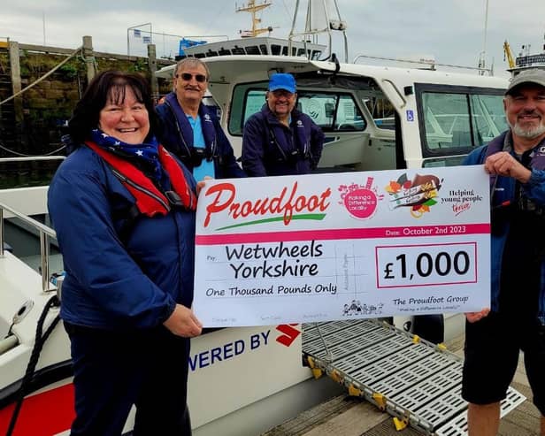 Proudfoot £1,000 cheque presentation to Wetwheels.