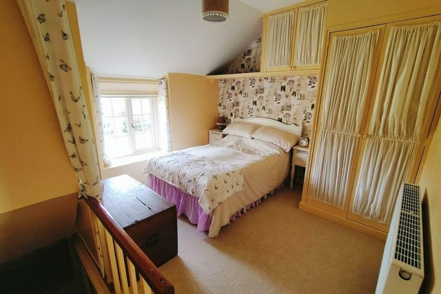 One of four bedrooms within the character property.