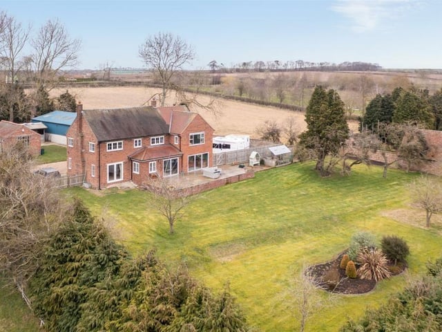 Looking over the extensive gardens to the rear of the property.