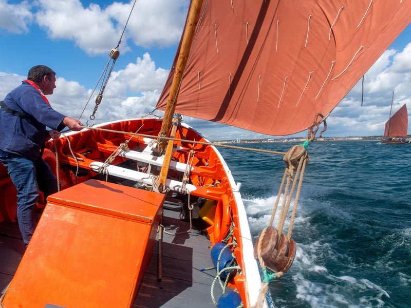 Crewman Stewart McKie control's the sail of Imperialist.