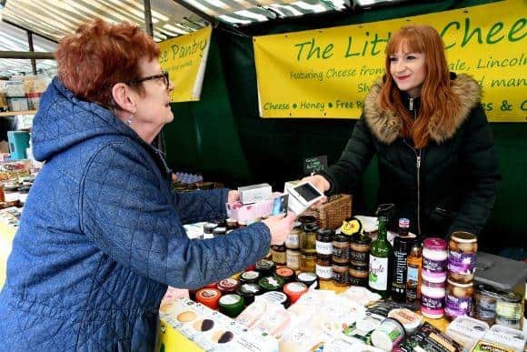 Lisa Gray, of The Little Cheese Pantry on Beverley’s Saturday Market, taking a card payment with the help of free Wi-Fi. (Pictures: East Riding of Yorkshire Council).