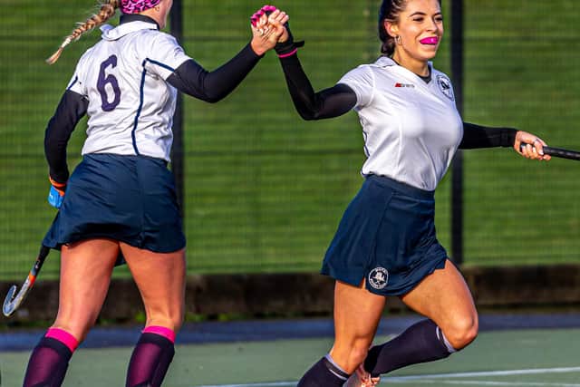 Whitby's Millie Storr (right) celebrates scoring the opener with number 6 Dani Braithwaite.