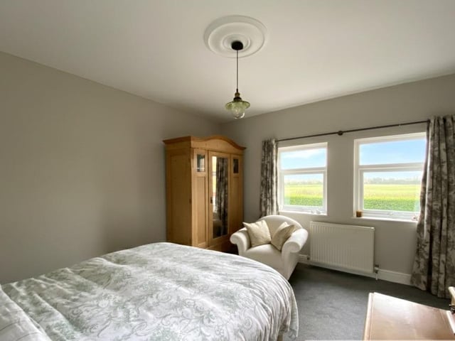 A bedroom with open country views.