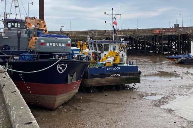 Ian Sandy captures the dredger in the harbour at low tide