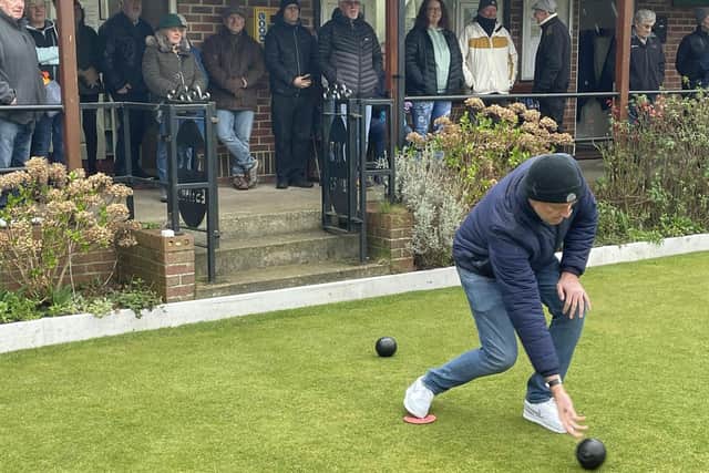New Borough Bowling Club president Andy Adamson bowls the first woods of the season