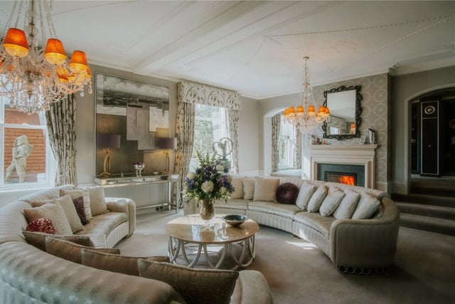 A stunning reception room with feature fireplace.
