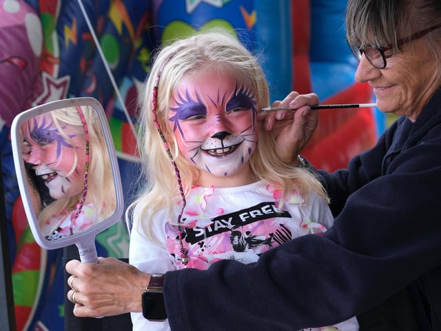 Festival face painting fun with Sandra Moseley creating amazing designs