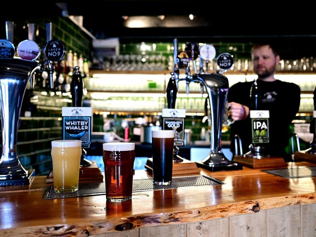 Richard Wells in the bar with beers to suit all tastes!