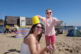 A family having fun in the sun on Scarborough's South Bay Beach
