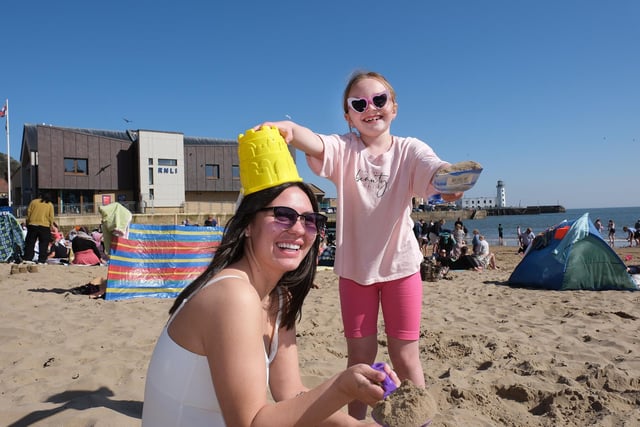 A family having fun in the sun on Scarborough's South Bay Beach