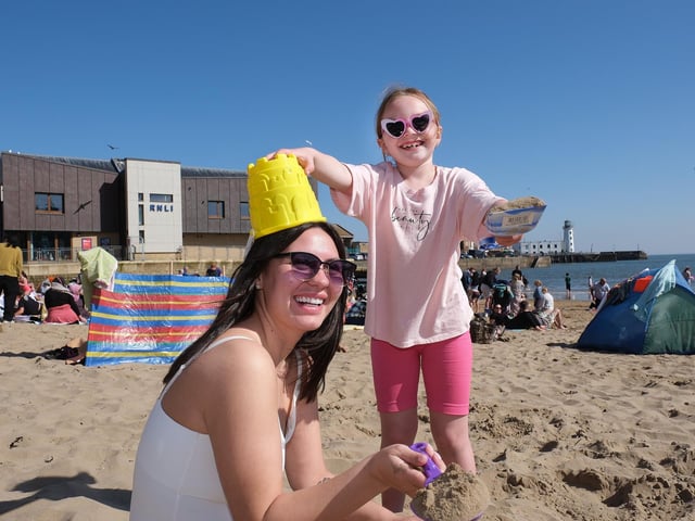 A family having fun in the sun on Scarborough's South Bay Beach