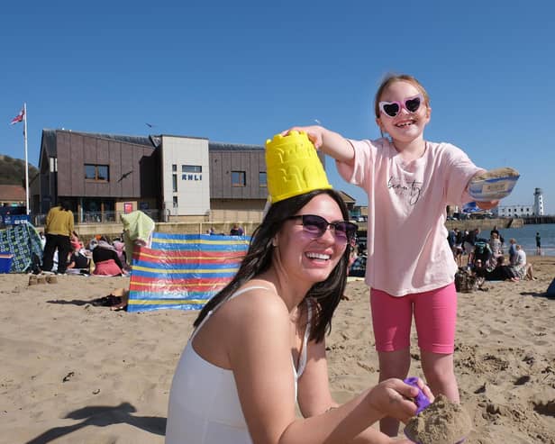 A family having fun in the sun on Scarborough's South Bay Beach