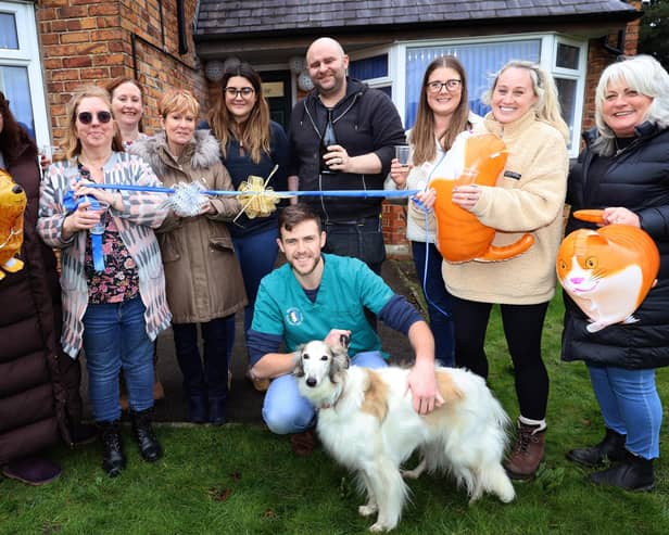 Senior vet Jim McCann (back row centre) and the team from Swanzdale Vets with Wind Hound, Meika, stealing the show front and centre.