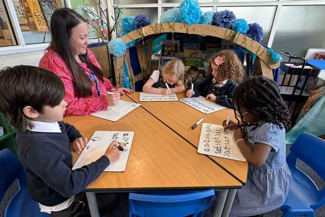 A proud time for the school to be recognised nationally. Pictured is teacher Mrs Angela Smith with pupils.