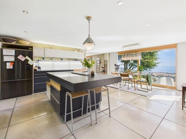 Glazing reveals spectacular views from the living kitchen.