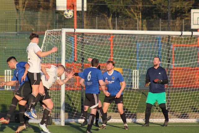 Kieran Link heads the ball over the Boro bar.