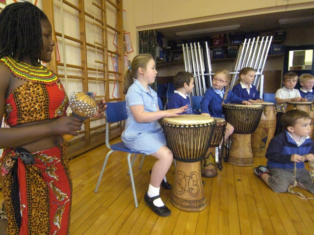 Children from Sleights School playing the African drums for Zimbabwean day.
w092507b
