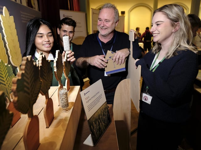 Anglo American stand with Gareth Sellers and Richard Adams with a Lady Lumley's pupil and staff member Emily Holbrook
