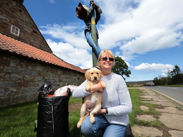 Katy with Edie the puppy and the Tremors scarecrow