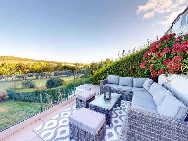 Outdoor comfort when entertaining in this sunny but sheltered spot.