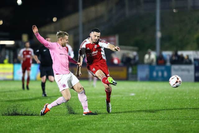 Frank Mulhern fires a shot at the Curzon Ashton goal. Photos by Zach Forster