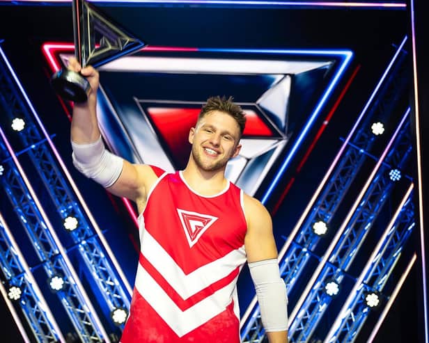 Scarborough's Joe Fishburn lifts the Gladiators trophy - Image courtesy BBC