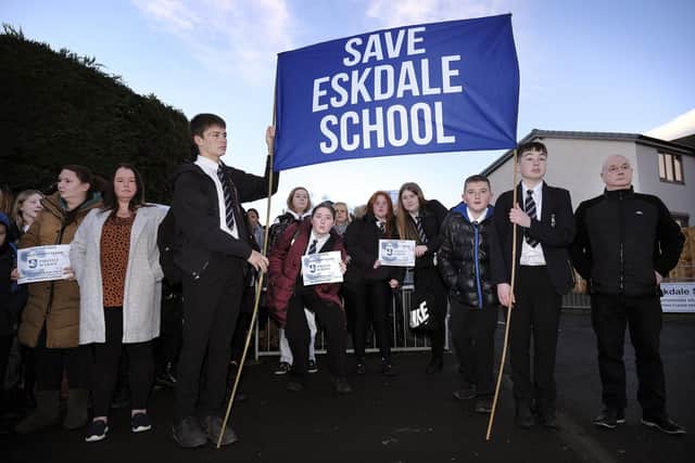 Campaigners gather at the school gates
